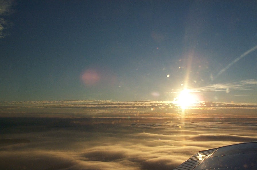 Wing of Cherokee GUKG over the Strait of Georgia during trianing flight.  December 3, 2008.  Langley Flying School.